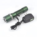 Green spiked tactical self-defense led flashlight with textured grip and black charging adapter for reliable use