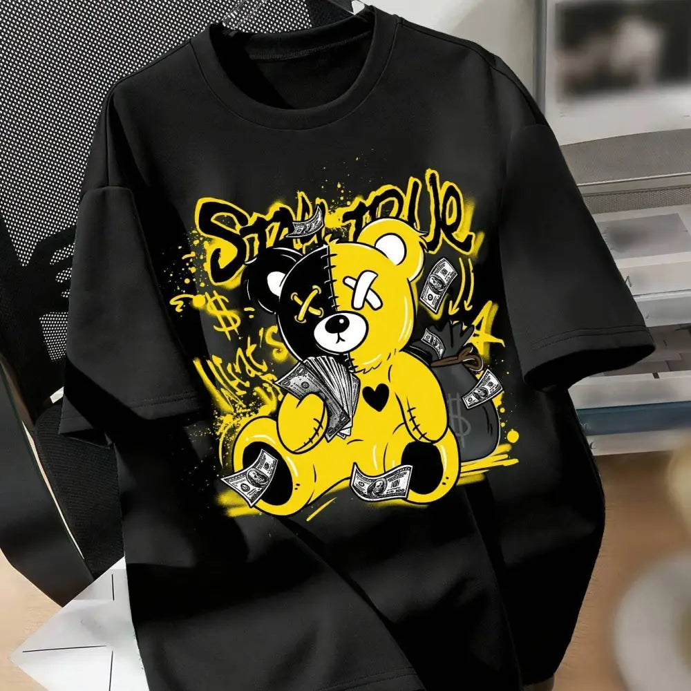 Black short-sleeved printed casual t-shirt with a bold yellow and black splicing bear letter graphic holding money