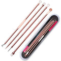 Rose gold-toned steel beauty needle set with textured grip handles and various tips in a zippered case for acne extraction