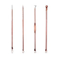 Set of four rose gold-toned stainless steel beauty needle tools with textured handles and zippered case for acne extraction