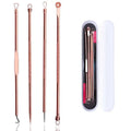 Set of four rose gold-toned steel beauty needles with textured grips in a white zippered case for acne extraction