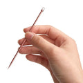 Rose gold-toned steel beauty needle with textured grip and pointed tip from stainless steel beauty needle set with zippered case
