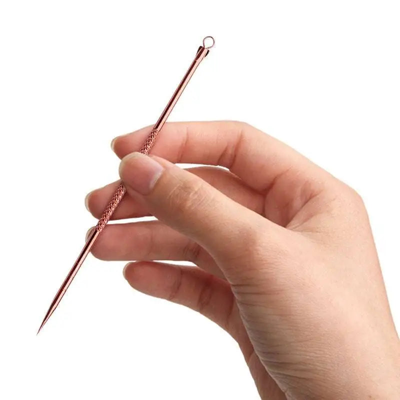 Rose gold-toned steel beauty needle with textured grip and pointed tip from stainless steel beauty needle set with zippered case