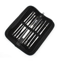 Set of ten stainless steel beauty needle tools neatly arranged in a black zippered case for facial cleansing