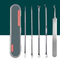 Set of five stainless steel beauty needle set tools with textured grips in a clear zippered case for acne extraction