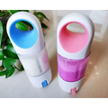 Two colorful white-bodied portable blender bottles with blue and pink interiors for efficient lemon juicing use