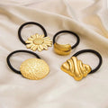 Gold-colored stainless steel flower elastic hair ties with intricate design and black elastic bands for secure hold