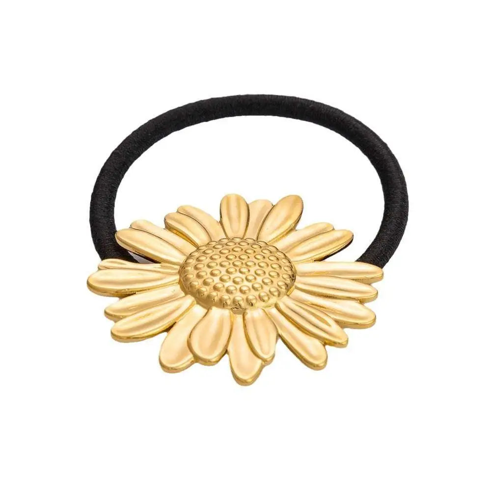 Gold-colored stainless steel flower elastic hair tie with black band for secure hair styling elastic hair ties