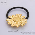 Gold-colored stainless steel flower elastic hair tie with black elastic band for secure hair styling