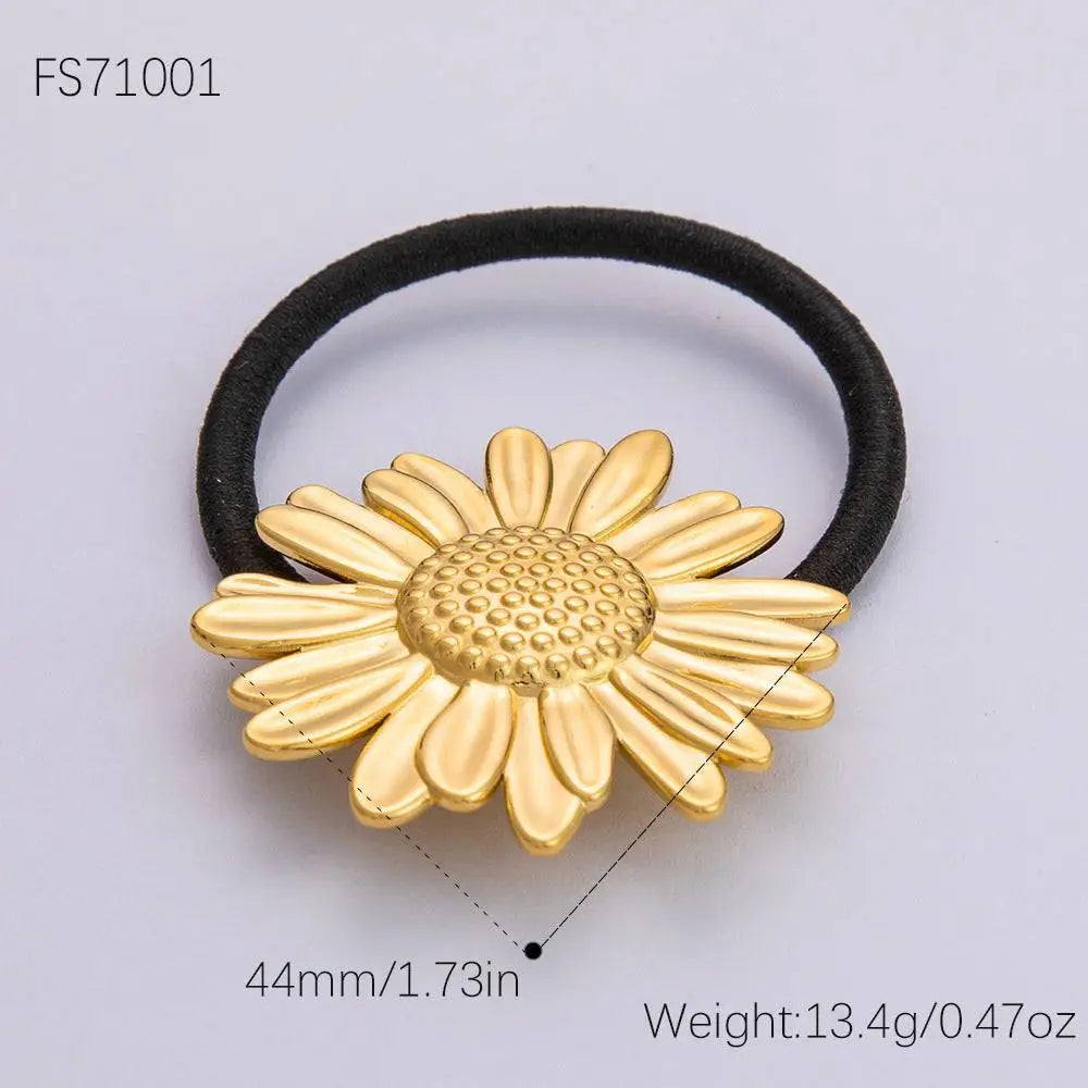 Gold-colored stainless steel flower elastic hair tie with black elastic band for secure hair styling