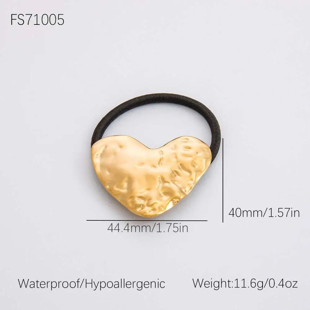 Gold-toned hammered heart shaped stainless steel flower elastic hair tie with black band for secure styling