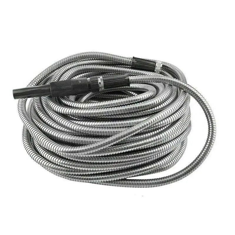 Coiled stainless steel metal garden hose with black plastic connectors and spray nozzle for outdoor watering tasks