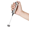 A sleek stainless steel milk frother and coffee stirrer with a coiled wire whisk for use as an egg beater