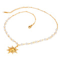 Stainless steel pearl necklace featuring a gold sun pendant with small white pearls on a delicate chain