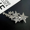 A sparkling silver star diamond barrettes adorned with clear rhinestones featuring small pentagrams for pentagrams head styling
