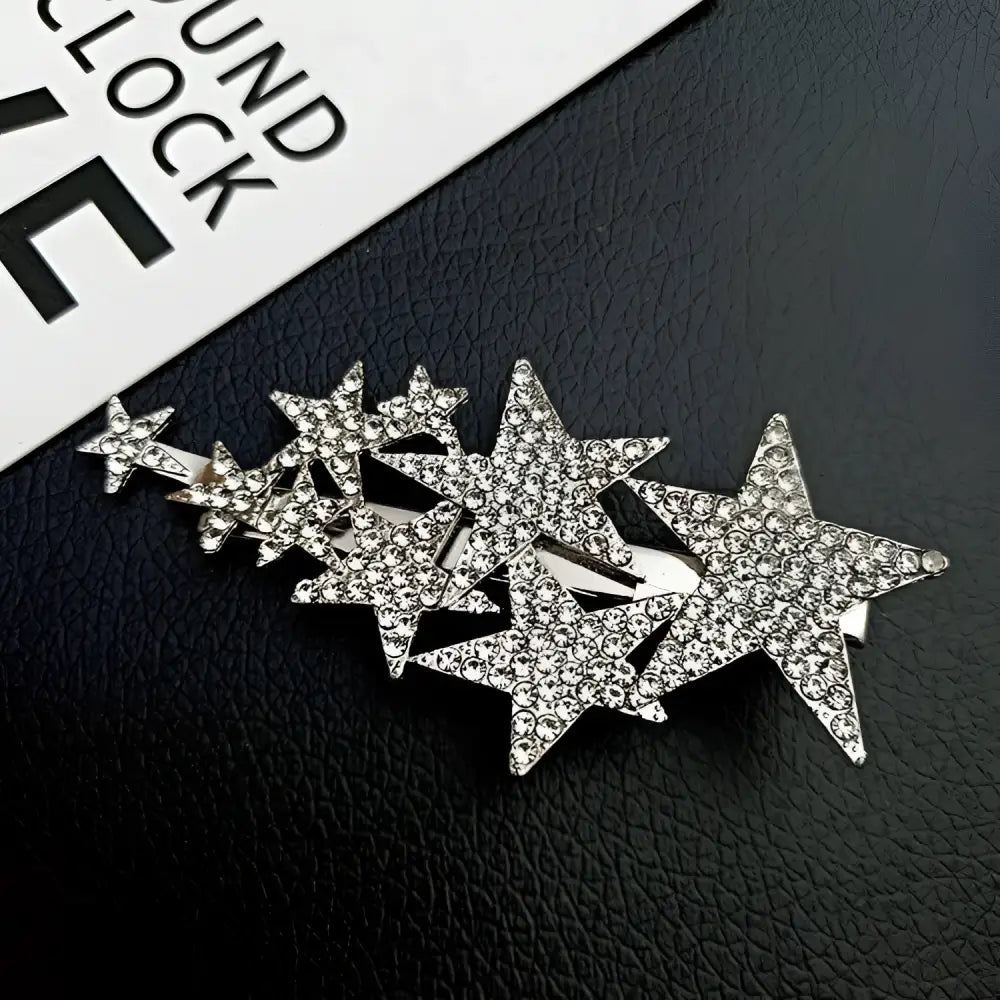 A sparkling silver star diamond barrettes adorned with clear rhinestones featuring small pentagrams for pentagrams head styling