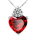 Sterling silver necklace with a sparkling red heart pendant and clear diamond accent on a delicate chain