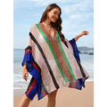 A plus size bikini striped loose plus mesh poncho with bold vertical stripes in green blue red and black on beige