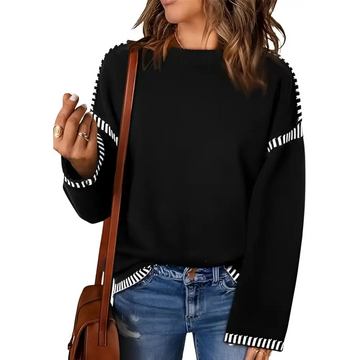 Black knit pullover knit sweater with white striped accents on sleeves and hem featuring a round neck pullover design
