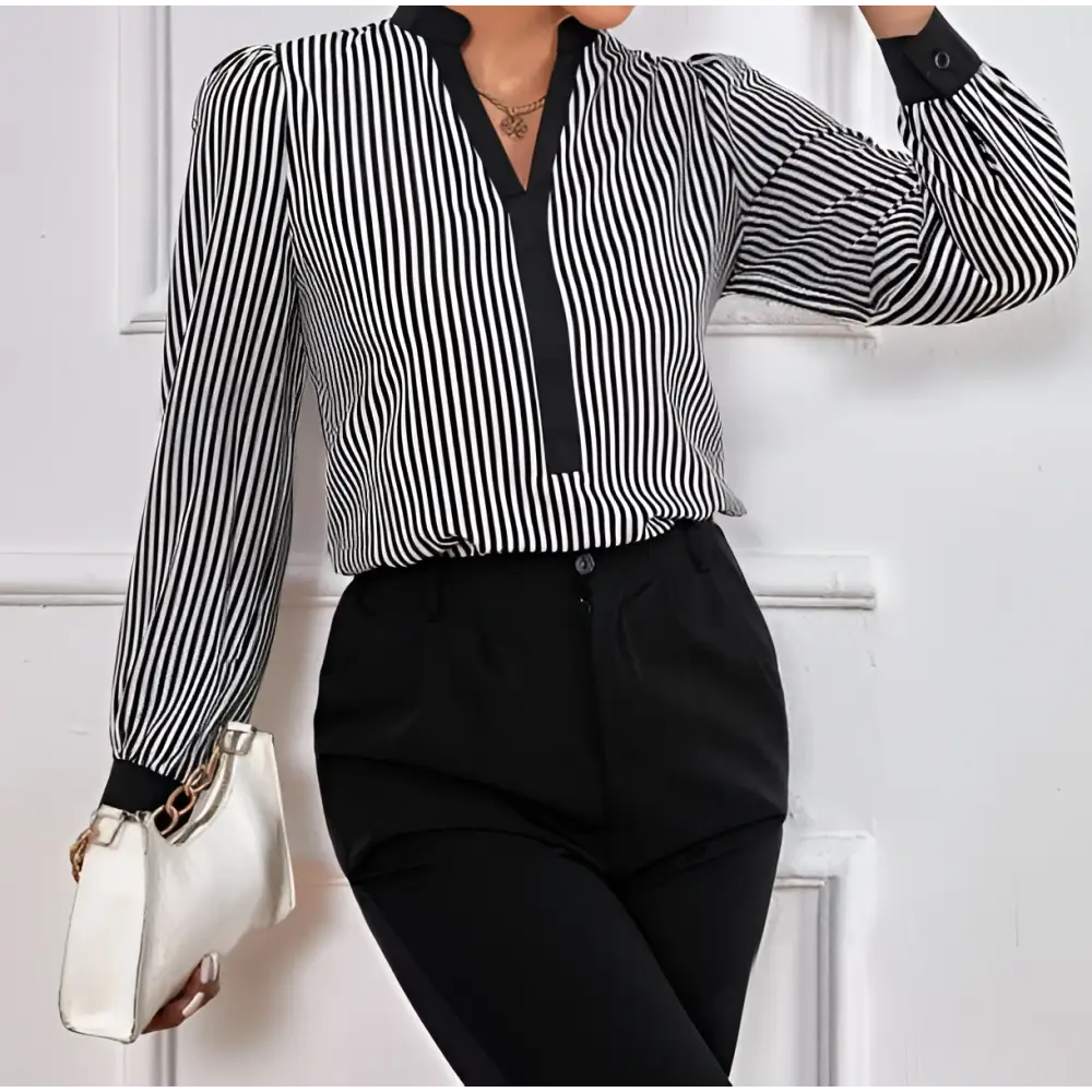 Black and white vertically striped long-sleeved block splicing shirt with v-neckline and cuff collar color trim