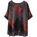 Stylish loose round neck printed patchwork blouse with bold red and gray floral geometric panels on dark fabric