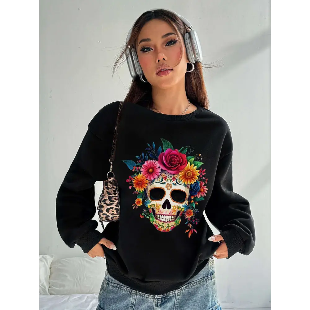 Black crew neck sweatshirt featuring a vibrant colorful floral sugar skull design for daily wear
