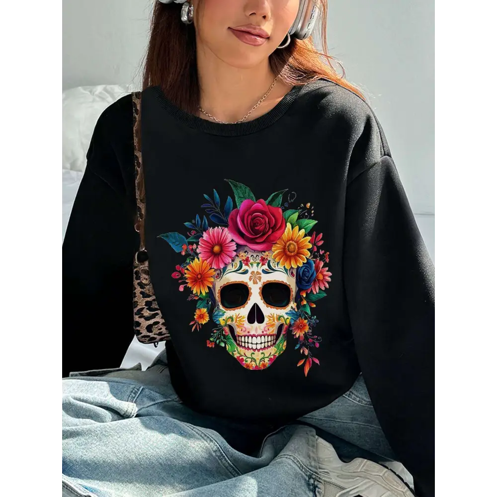 Black crew neck sweatshirt featuring a vibrant colorful floral skull design with roses for daily wear