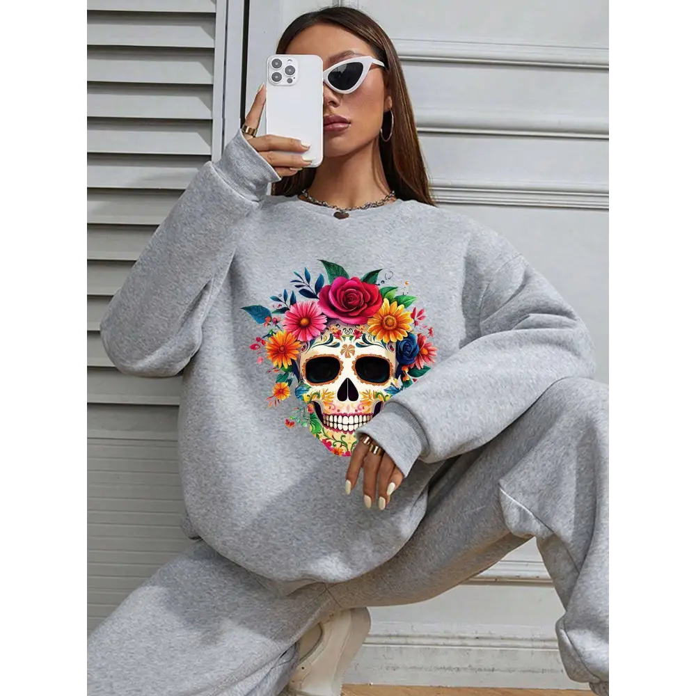 Gray crew neck sweatshirt featuring a vibrant colorful floral skull design for daily casual wear