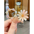A pastel pink and white alloy handmade petal hair clip with glittery details and a golden center for handmade temperament