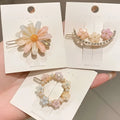 Pastel pink alloy handmade petal hair clips with delicate resin petals and sparkling embellishments for summer style