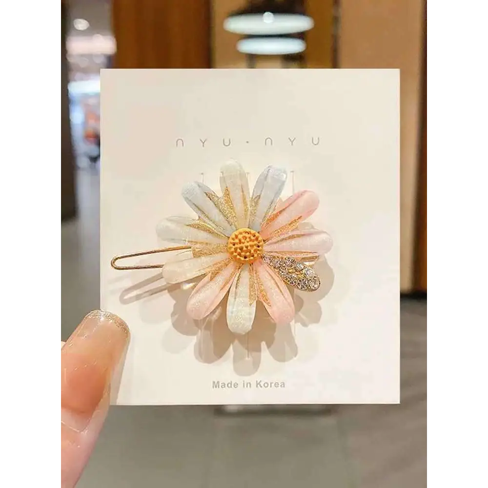 A set of five alloy handmade petal hair clips in pastel pink adorned with pearls and rhinestones on a white card