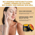 Black and orange jar of soft brown suntanning beauty cream with yellow interior for even skin tone and natural ingredients