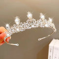 A sparkling silver crown headband with clear crystals and pear-shaped stones from sweet fashion jewelry
