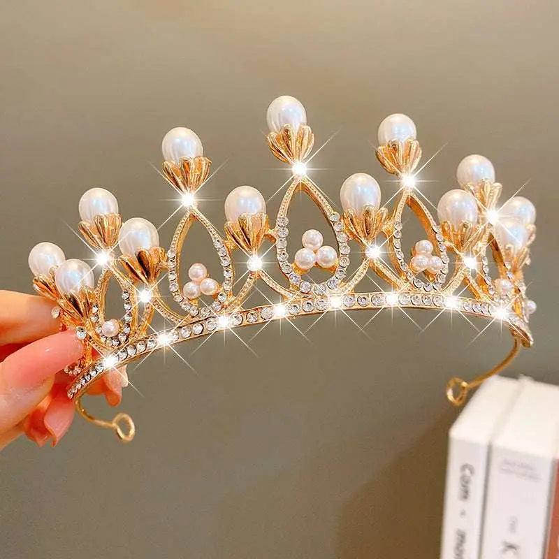 A golden crown headband from sweet fashion jewelry adorned with white pearls and clear crystals rhinestones
