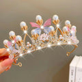 A delicate gold crown headband with white pearls clear crystals and pastel fabric butterflies from sweet fashion jewelry