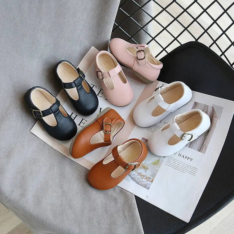A collection of toddler mary jane shoes in tan leather and other colors featuring versatile single shoes with buckle details