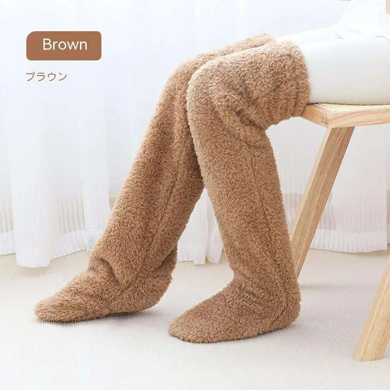 Tan paw print fuzzy long socks in brown plush fleece with a soft textured surface over the knee length