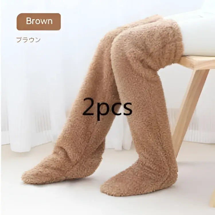 Tan paw print fuzzy long socks in brown plush material designed for warmth and comfort over the knee