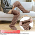 Tan paw print fuzzy long socks are brown plush over-the-knee socks with a soft stretchy texture