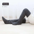 Dark gray plush fuzzy long socks with tan paw print featuring a soft fuzzy texture and over-the-knee length