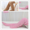 Soft plush fuzzy long socks in tan paw print design with brown and pink hues over-the-knee length