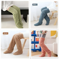 Soft plush fuzzy long socks in green blue brown and pink with tan paw print detail for cozy wear