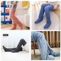 Tan paw print fuzzy long socks in fluffy plush over the knee design with soft peach, blue, and gray hues