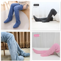 Tan paw print fuzzy long socks in blue, dark gray, and pink purple plush over-the-knee design