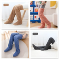 Fluffy long-over-the-knee thermal fuzzy long socks in tan paw print colors brown, peach, blue, and gray plush