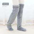 Tan paw print fuzzy long socks in light gray plush with soft fluffy texture over the knee length