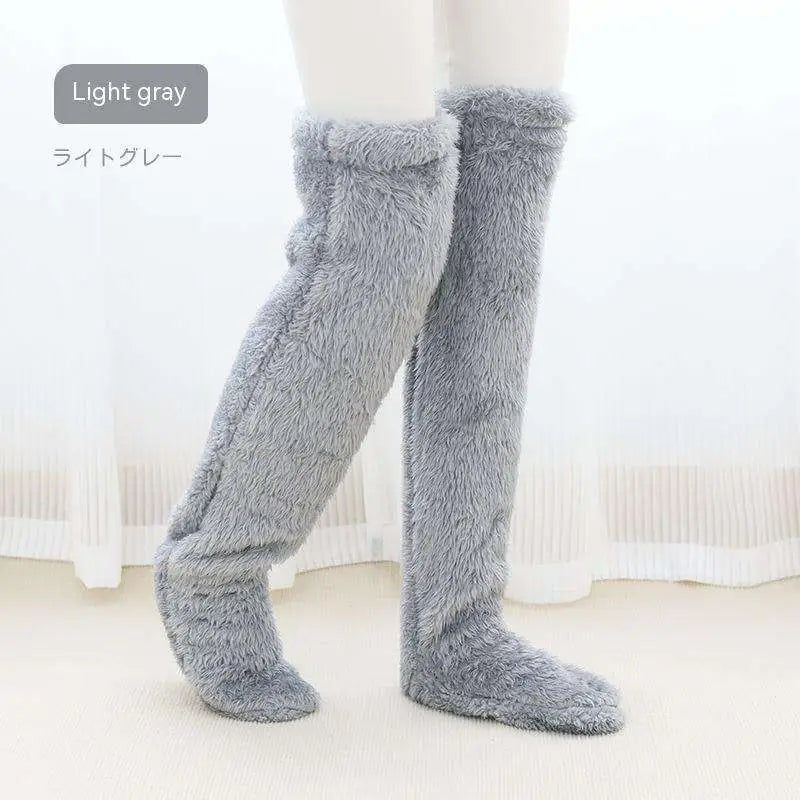 Tan paw print fuzzy long socks in light gray plush with soft fluffy texture over the knee length