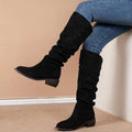 Black suede over-the-knee high leg boot with low block heel and gathered fabric at the top for a sleeve suede high look