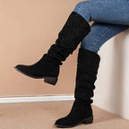 Black suede over-the-knee high leg boot with low block heel and gathered fabric at the top for a sleeve suede high look