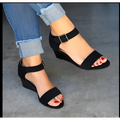 Black suede wedge sandals with adjustable ankle straps featuring a sleek fashion wedge buckle strap design
